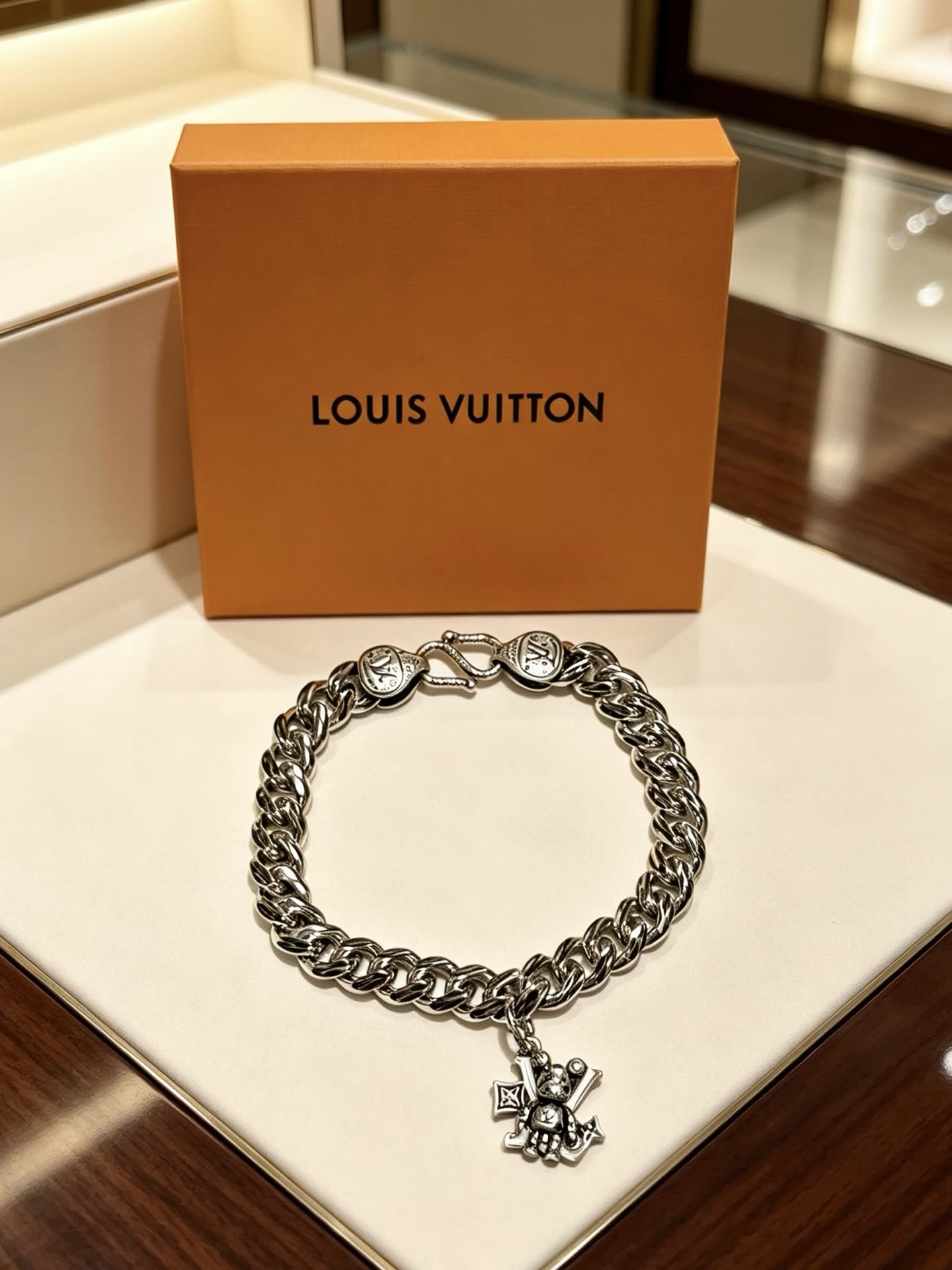 Louis Vuitton Silver Tone Bracelet with Monogram Charm